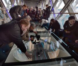 Members of the media capture the view from the newly installed glass floor 138 feet above the River Thames at Tower Bridge, London, after a £1 million improvement. Glass floor unveiled at Tower Bridge. The floor will allow visitors a view of the bridge lifts and is the most significant change since the Tower bridge Experience opening in 1982. See PA story TOURISM TowerBridge.
(John Stillwell/PA Wire http://www.towerbridge.org.uk)