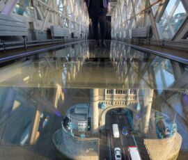 Daniella Marchesi walks across the 11 meter by 1.8 meter wide newly installed glass floor 138 feet above the River Thames at Tower Bridge, London, after a £1 million improvement. Glass floor unveiled at Tower Bridge. The floor will allow visitors a view of the bridge lifts and is the most significant change since the Tower bridge Experience opening in 1982. See PA story TOURISM TowerBridge.
(John Stillwell/PA Wire http://www.towerbridge.org.uk)