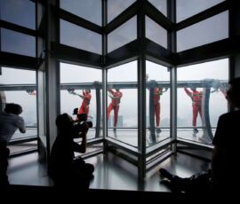 Jin Mao employee walks 340 meters above the ground around the newly opened Jin Mao tower skywalk in Shanghai. (Photo: Reuters)